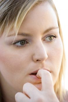 Woman biting her nails